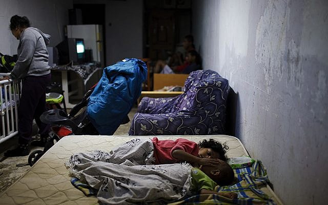 Israeli family sleeps in a bomb shelter. (Photo by Dima Vazinovich/Wiki Creative Commons)