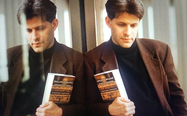 Daniel Goldhagen holds a copy of "Hitler's Willing Executioners."