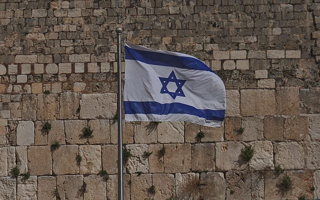 Israeli national flag waving at the historic Western Wall in Jerusalem from the Pexels website (https://www.pexels.com/photo/photo-of-the-national-flag-of-israel-6851497/)