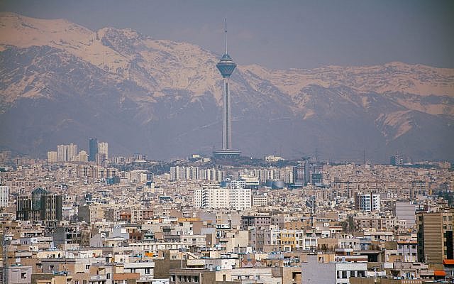 Aerial view of Tehran featuring Milad Tower against the Alborz Mountains from the website Pexels (https://www.pexels.com/photo/milad-tower-and-tehran-cityscape-with-alborz-mountains-31262146/).