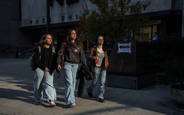 People leave a polling location in New York City during the mayoral election on Tuesday, Nov. 4, 2025, in New York. (AP Photo/Olga Fedorova)