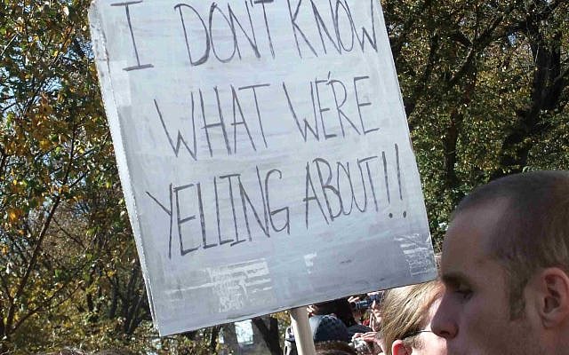 Protester holding sign reading "I Don't Know What We're Yelling About!" (Photo by Martha Soukup/Flickr)