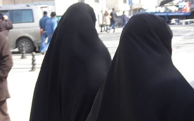 Illustrative: Two Muslim women wearing the burqa and niqab in Haifa. (David Lisbona, CC BY 2.0, via Wikimedia Commons)