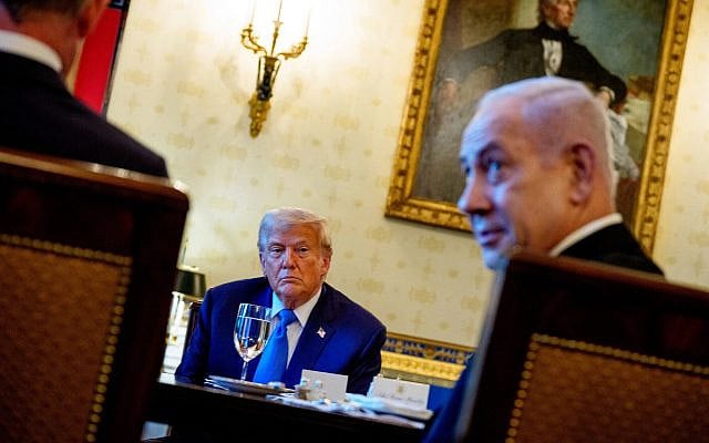 Prime Minister Benjamin Netanyahu, right, speaks, as US President Donald Trump looks on during a dinner in the Blue Room of the White House in Washington, July 7, 2025. (Andrew Harnik/ Getty Images/ AFP)