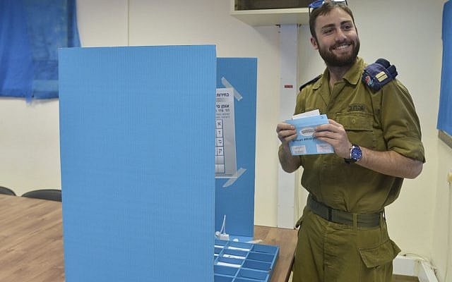 Illustrative: A soldier cast his vote for in the general elections for the 20th parliament, at the Navy military base in Haifa on March 15, 2015. (Flash90)
