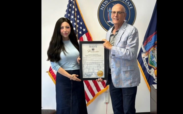 Linda Sadacka receives a New York State Senate proclamation from Senator Sam Sutton recognizing her community advocacy through journalism, social media and civic engagement. (Screenshot courtesy of the author.)