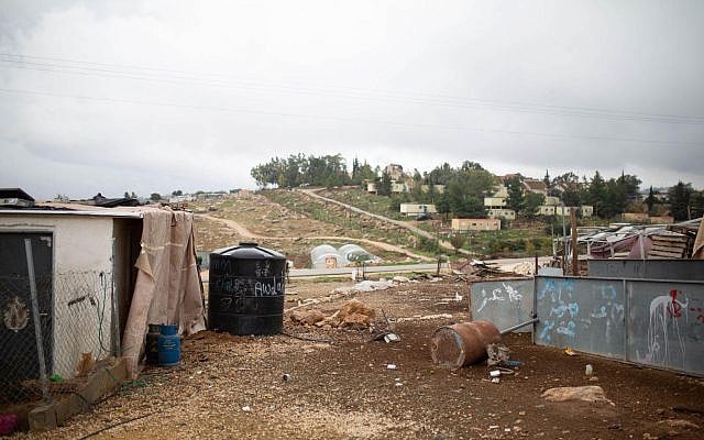 The Palestinian village of Umm al-Khayr in the West Bank, adjacent to the Israeli settlement of Carmel.