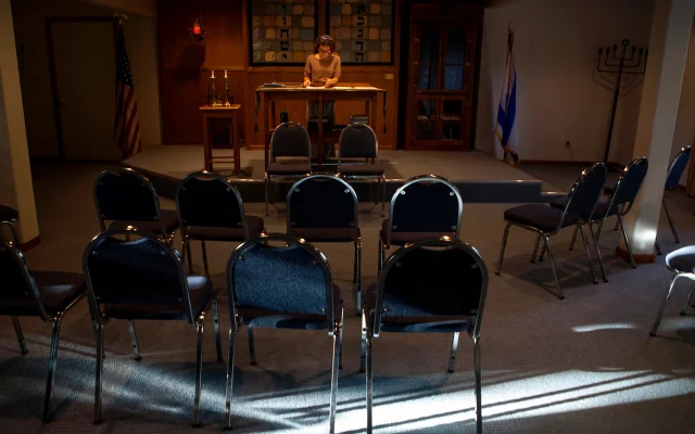 FILE: A rabbinical student reads at the Synagogue of the Black Hills in Rapid City, S.D., September 12, 2014. (AP Photo/Kristina Barker)