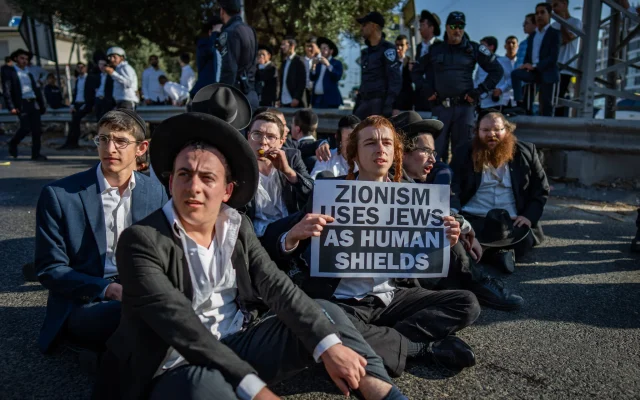 Ultra-Orthodox demonstrators clash with police during a protest against the drafting of Haredi youth near Bnei Brak, June 5, 2025. (Erik Marmor/Flash90)