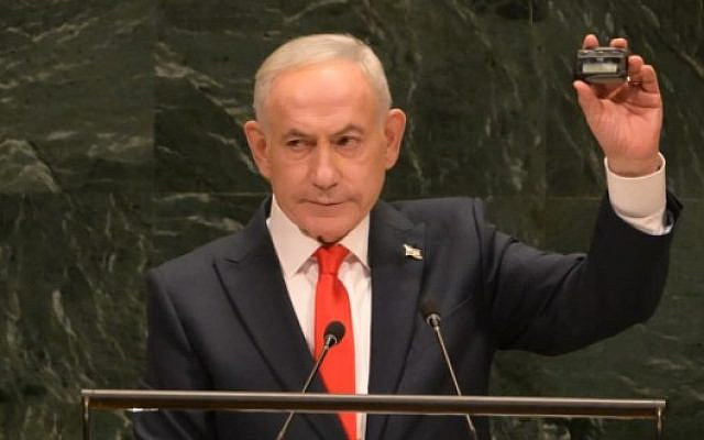 Israeli Prime Minister Benjamin Netanyahu highlights a point by brandishing a beeper at the UN General Assembly on September 24. (Avi Ohayon/GPO)