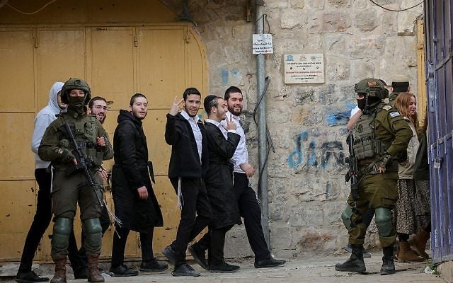 Israeli security forces guard as Jews tour in the West Bank city of Hebron, on January 31, 2026. Photo by (Wisam Hashlamoun/FLASH90)