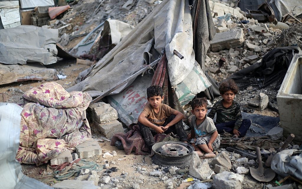 Palestinian children sit amid the destruction in the aftermath of an Israeli strike in the Bureij refugee camp in the central Gaza Strip on July 10, 2025. (Eyad BABA / AFP) Palestinian children sit amid the destruction in the aftermath of an Israeli strike in the Bureij refugee camp in the central Gaza Strip on July 10, 2025. (Eyad BABA / AFP)