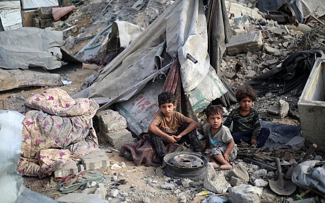 Palestinian children sit amid the destruction in the aftermath of an Israeli strike in the Bureij refugee camp in the central Gaza Strip on July 10, 2025. (Eyad BABA / AFP)