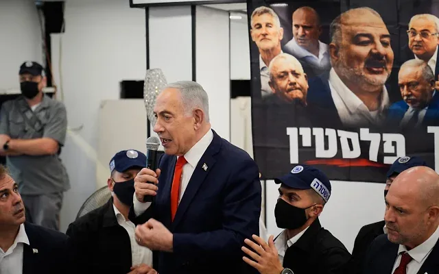 Prime Minister Benjamin Netanyahu speaks to supporters during a campaign appearance at a market in Tel Aviv, Israel, October 22, 2026. (AP Photo/David Goldman)