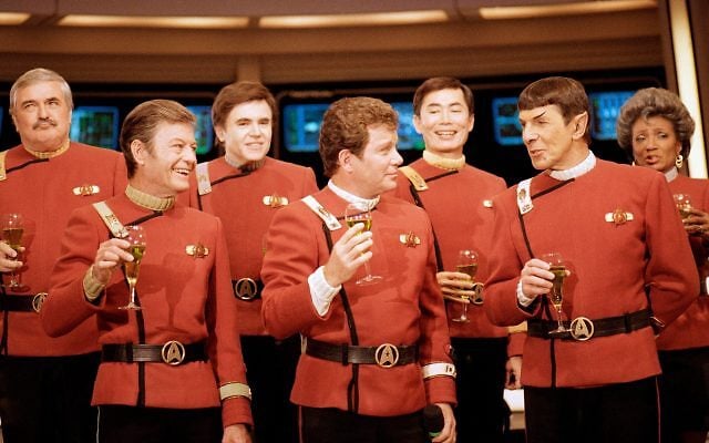 Members of the "Star Trek" crew, from left, James Doohan, DeForest Kelley, Walter Koenig, William Shatner, George Takei, Leonard Nimoy, and Nichelle Nichols, toast the newest "Star Trek" film at Paramount Studios on Dec. 28, 1988. (AP Photo/Bob Galbraith, File)