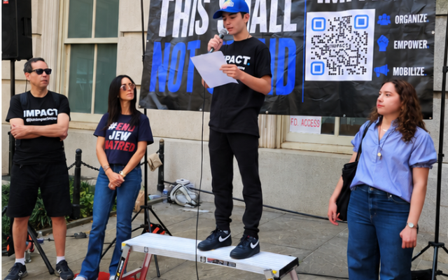 Michael Herman speaks at a campus rally. (Courtesy of Aaron Herman)