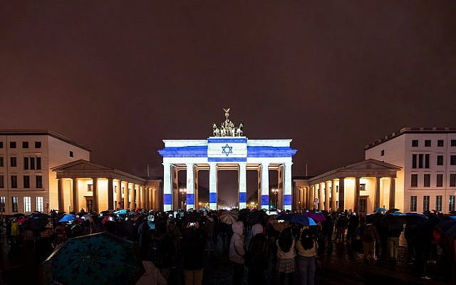 The Brandenburg Gate in Berlin lights up with the Israeli flag in solidarity after a multi-front Hamas attack, October 7, 2023. (Press and Information Office of the Federal Government)
