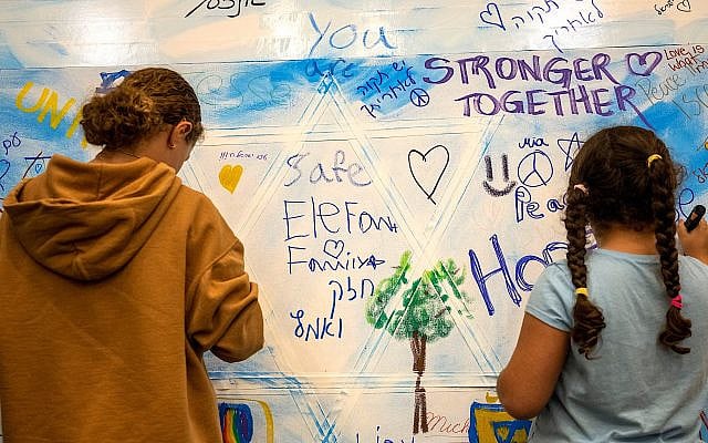 Students at Beth El Temple in West Hartford, Connecticut add to a communal art piece marking the one-year anniversary of the Oct. 7 attacks, Oct. 7, 2024. (Tyler Russell/Connecticut Public via Getty Images)