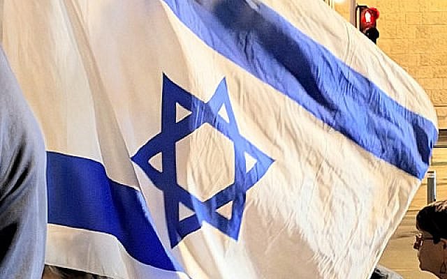 A participant's flag Kikar Paris gathering on October 6th, 2026
