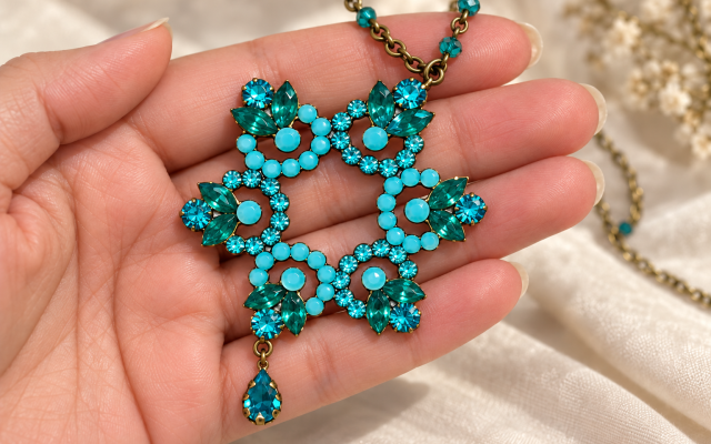 Image of a hand holding a Jewish Star necklace | Created by Jodi L. Goldfinger using AI tools on October 7, 2026