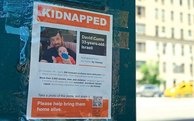 The documentary "Torn" (2024) examines the poster wars in New York City, when activists put up signs calling attention to Israeli hostages in Gaza, and others ripped them down. (Courtesy Nim Shapira)
