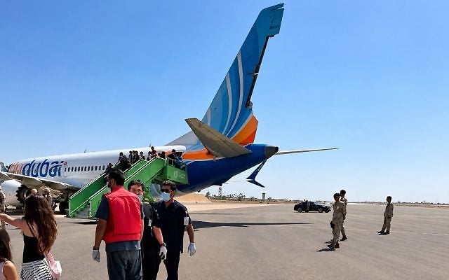 Passengers disembark from a flydubai Boeing 737 MAX en route from Dubai to Tel Aviv after it landed at Tabuk Airport in Saudi Arabia on September 30, 2026. The aircraft's rudder shows damage. The flight was targeted in a terrorist attack midair, with the copilot subdued after attacking the captain with a crash axe in an apparent attempt to crash the plane carrying Israeli passengers. (Social media; used in accordance with Clause 27a of the Copyright Law.) Passengers disembark from a flydubai Boeing 737 MAX en route from Dubai to Tel Aviv after it landed at Tabuk Airport in Saudi Arabia on September 30, 2026. The aircraft's rudder shows damage. The flight was targeted in a terrorist attack midair, with the copilot subdued after attacking the captain with a crash axe in an apparent attempt to crash the plane carrying Israeli passengers. (Social media; used in accordance with Clause 27a of the Copyright Law.)