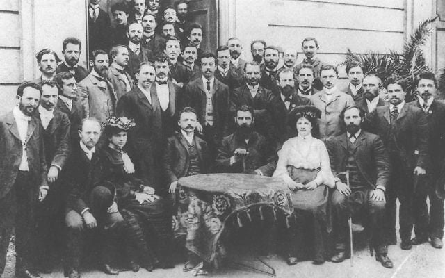 Theodor Herzl with members of the Democratic Fraction at the Fifth Zionist Congress, Basel, 1901. Tzipora and Joseph Klausner are among those standing in the third row. Martin Buber Archive, National Library of Israel. Public domain. Theodor Herzl with members of the Democratic Fraction at the Fifth Zionist Congress, Basel, 1901. Tzipora and Joseph Klausner are among those standing in the third row. Martin Buber Archive, National Library of Israel. Public domain.