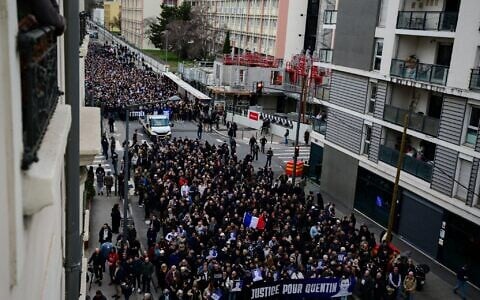 Protesters attend a march in tribute to far-right activist Quentin Deranque, who died after being attacked on the sidelines of a far-right protest against a La France Insoumise (LFI) event at Sciences Po Lyon, in Lyon on February 21, 2026. (OLIVIER CHASSIGNOLE / AFP)