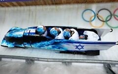 Israel's AJ Edelman (left) Menachem Chen, Uri Zisman and Omer Katz slide down the track during a four-man bobsleigh run at the 2026 Winter Olympics, in Cortina d'Ampezzo, Italy, February 21, 2026. (AP/Aijaz Rahi)