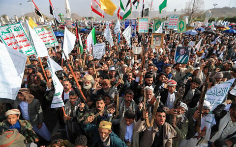 Armed Yemeni supporters of the Iran-backed Houthi movement brandish their weapons during a protest against US strikes on Iran in Sanaa on July 10, 2026. (Mohammed HUWAIS/AFP)
