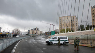 Israeli Police officers at a temporary "checkpoint"  in Jerusalem on April 11, 2020, to check if people are not disobeying the governments orders on a partial lockdown, in order to prevent the spread of the Coronavirus.
Photo by Olivier Fitoussi/Flash90 *** Local Caption *** ??????
?????
?????
?????
???? ????
????
???
??? ???????