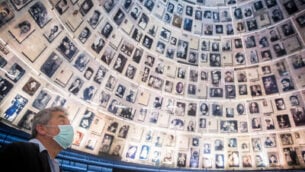 Yad Vashem Security guard stands at the empty Hall of Names in the Yad Vashem Holocaust Memorial Museum in Jerusalem on April 19, 2020. In order to prevent the spread of the coronavirus disease, the Yad Vashem Museum will remain close this year on Holocaust Remembrance Day, but will switch its main activities on their website and social media. Photo by Yonatan Sindel/Flash90 *** Local Caption *** יום השואהשואהיד ושם
							<p class=