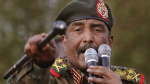 Sudanese Gen. Abdel-Fattah Burhan, head of the military council, speaks during a military-backed rally, in Omdurman district, west of Khartoum, Sudan, Saturday, June 29, 2019. Sudan's ruling military council on Saturday warned protest leaders of "destruction or damage" ahead of planned mass rallies over the weekend calling for civilian rule over two months after the military ouster of autocratic president Omar al-Bashir. (AP Photo/Hussein Malla)