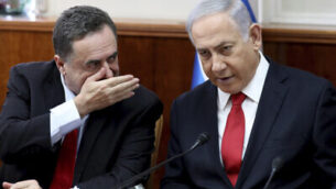 Israeli Prime Minister Benjamin Netanyahu, right, listens to Foreign Minister Israel Katz during the weekly cabinet meeting at his office in Jerusalem, Sunday, Oct. 27, 2019.  Israel's prime minister says he wants a "broad national unity government" amid political deadlock over forming a government following last month's elections. Speaking to his Cabinet, Benjamin Netanyahu said such a coalition is essential for Israel to face what he said were mounting security challenges around the region. (Gali Tibbon/Pool Photo via AP)