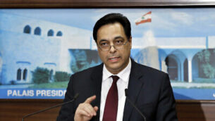 Lebanese Prime Minister Hassan Diab speaks during a news conference after his government was announced, at the Presidential Palace in Baabda, east of Beirut, Lebanon, Tuesday, Jan. 21, 2020. A new Cabinet was announced in crisis-hit Lebanon late Tuesday, breaking a months-long impasse amid ongoing mass protests against the country's ruling elite. (AP Photo/Bilal Hussein)