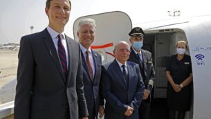 US Presidential Adviser Jared Kushner (L), US National Security Adviser Robert OBrien (2nd-L) and Head of Israel's National Security Council Meir Ben-Shabbat (C) pose for a picture with the flight crew ahead of boarding the El Al's flight LY971, which will carry an Israeli-American delegation from Tel Aviv to Abu Dhabi, at the Ben Gurion Airport near Tel Aviv on August 31, 2020. - The El Al flight, scheduled to leave at 0730 GMT from Ben Gurion Airport near Tel Aviv, will carry a delegation led on the American side by President Donald Trump's son-in-law and White House advisor Jared Kushner. (Photo by NIR ELIAS / POOL / AFP)