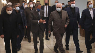 Director General of International Atomic Energy Agency, IAEA, Rafael Mariano Grossi, center left, speaks with Iran's Foreign Minister Mohammad Javad Zarif, center left, before a meeting in Tehran, Iran, Tuesday, Aug. 25, 2020. Grossi arrived in Iran on Monday to press for access to sites where authorities are thought to have stored or used undeclared nuclear material. (AP Photo/Vahid Salemi) Director General of International Atomic Energy Agency, IAEA, Rafael Mariano Grossi, center left, speaks with Iran's Foreign Minister Mohammad Javad Zarif, center left, before a meeting in Tehran, Iran, Tuesday, Aug. 25, 2020. Grossi arrived in Iran on Monday to press for access to sites where authorities are thought to have stored or used undeclared nuclear material. (AP Photo/Vahid Salemi)