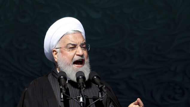 Iranian President Hassan Rouhani speaks during a ceremony celebrating the 41st anniversary of the Islamic Revolution, at the Azadi, Freedom, Square in Tehran, Iran, Tuesday, Feb. 11, 2020. Iranians took to the streets of Tehran and other cities and towns across the country on Tuesday for rallies and nationwide celebrations marking the anniversary of the 1979 Islamic Revolution when followers of Ayatollah Khomeini ousted U.S.-backed Shah Mohammad Reza Pahlavi. (AP Photo/Ebrahim Noroozi)