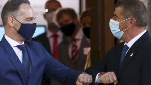 German Foreign Minister Heiko Maas, left, and his Israeli counterpart Gabi Ashkenazi bump elbows as they meet at the House of the Wannsee Conference in Berlin Thursday, Aug. 27, 2020. (Michele Tantussi/Pool Photo via AP)