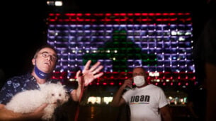 The Tel Aviv municipality on Rabin square, is lit up with the Lebanese flag, in solidarity with the victims who were killed in the Beirut explosion, on August 5, 2020. Photo by Miriam Alster/Flash90 *** Local Caption *** כיכר רביןתל אביבלבנון
							<p class=