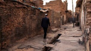 Ranj Abderrahman Cohen, an Iraqi Kurdish Jewish man, walks next to a ruined Jewish synagogue in Arbil, the capital of the autonomous Kurdish region of northern Iraq, on July 5, 2020. - Jews were historically Iraq's second-largest religious sect, comprising 40 percent of Baghdad's population according to a 1917 census. But since the creation of Israel in 1948, regional tensions skyrocketed and anti-Semitic campaigns took hold, pushing most of Iraq's Jews to flee. Today, Iraqis have fond memories of Jewish friends and neighbours, including 82-year-old Farhadi, whose father owned a shop in a Jewish-majority district of Arbil. (Photo by SAFIN HAMED / AFP)