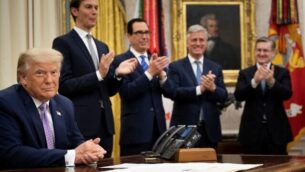 (L-R, rear) Senior Advisor Jared Kushner, US Secretary of the Treasury Steven Mnuchin and National Security Advisor Robert O'Brien clap for US President Donald Trump (L) after he announced an agreement between the United Arab Emirates and Israel to normalize diplomatic ties, the White House August 13, 2020, in Washington, DC. - Trump on Thursday made the surprise announcement of a peace agreement between Israel and the United Arab Emirates. The normalization of relations between the UAE and Israel is a "HUGE breakthrough" Trump tweeted, calling it a "Historic Peace Agreement between our two GREAT friends." (Photo by Brendan Smialowski / AFP)