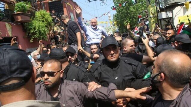Hamas' political bureau chief Ismail Haniyeh greets supporters during a visit to the Ain el-Helweh camp, Lebanon's largest Palestinian refugee camp, near the southern coastal city of Sidon on September 6, 2020. (Photo by Mahmoud ZAYYAT / AFP)