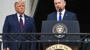 US President Donald Trump watches as Israeli Prime Minister Benjamin Netanyahu (R) speaks from the Truman Balcony at the White House during the signing ceremony of the Abraham Accords where the countries of Bahrain and the United Arab Emirates recognize Israel, on the South Lawn of the White House in Washington, DC, September 15, 2020. - Israeli Prime Minister Benjamin Netanyahu and the foreign ministers of Bahrain and the United Arab Emirates arrived September 15, 2020 at the White House to sign historic accords normalizing ties between the Jewish and Arab states. (Photo by SAUL LOEB / AFP)