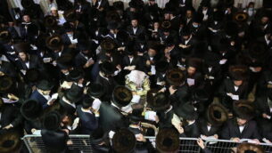Rabbi Elimelech Biderman and ultra-Orthodox Jews pray for forgivness (Selichot) at the burial site of Rabbi Shimon bar Yochai in Meron, northern Israel, September 12, 2020, ahead of the Jewish New Year. Selichot are usually recited between midnight and dawn. Selichot services starts on the second day of the Hebrew month of Elul. Photo by David Cohen/Flash90 *** Local Caption ***
