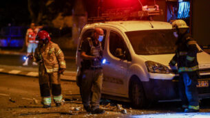 Police and medical personnel at the scene where a rocket fired from the Gaza Strip hit a road in the southern Israeli city of Ashdod on September 15, 2020. Photo by Flash90 *** Local Caption *** àùãåãâáøøñéñéí
							<p class=
