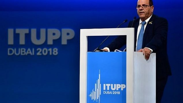 تصویر: ایوب کارا وزیر ارتباطات حین سخنرانی در کنفرانس اتحاد تام الاختیار بین المللی مخابرات در دوبی، امارات متحد عربی، ۳۰ اکتبر ۲۰۱۸. (Stringer/AFP) تصویر: ایوب کارا وزیر ارتباطات حین سخنرانی در کنفرانس اتحاد تام الاختیار بین المللی مخابرات در دوبی، امارات متحد عربی، ۳۰ اکتبر ۲۰۱۸. (Stringer/AFP)