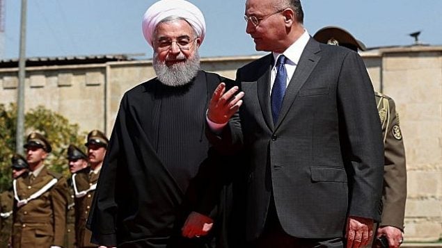 برهام صالح رئیس جمهور عراق، راست، پس از بازدید از یک گارد افتخار در قصر سلام، بغداد، ۱۱ مارس ۲۰۱۹، در کنار حسن روحانی رئیس جمهور ایران گام برمی دارد. (AP Photo/Khalid Mohammed) برهام صالح رئیس جمهور عراق، راست، پس از بازدید از یک گارد افتخار در قصر سلام، بغداد، ۱۱ مارس ۲۰۱۹، در کنار حسن روحانی رئیس جمهور ایران گام برمی دارد. (AP Photo/Khalid Mohammed)