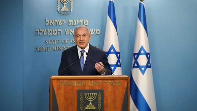 Israeli prime minister Benjamin Netanyahu speaks during a press conference about the coronavirus COVID-19, at the Prime Ministers office in Jerusalem on March 25, 2020. Photo by Olivier Fitoussi/Flash90 *** Local Caption *** ביבי
ראש הממשלה בנימין נתניהו
יעקב
ליצמן
שר הבריאות
קורונה
וירוס
מגפה
משרד הבריאות
