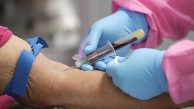 A health worker draws blood from a patient for a COVID-19 antibody test at the Volusia County Fairgrounds, Tuesday, May 5, 2020, in DeLand, Fla. (AP Photo/John Raoux) A health worker draws blood from a patient for a COVID-19 antibody test at the Volusia County Fairgrounds, Tuesday, May 5, 2020, in DeLand, Fla. (AP Photo/John Raoux)